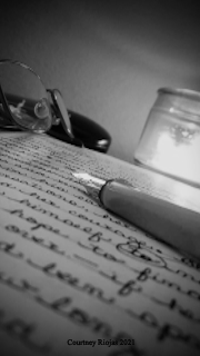 A fountain pen placed on a hand-written page.